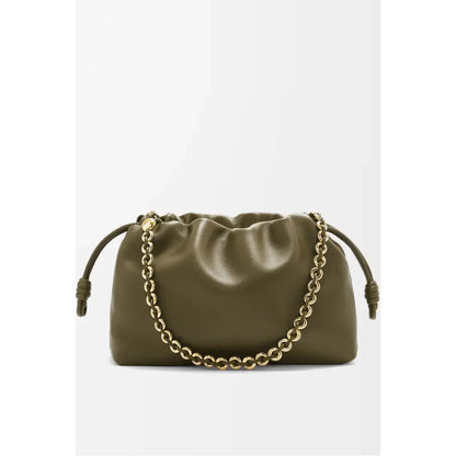 Green handbag with a gold chain on a white background