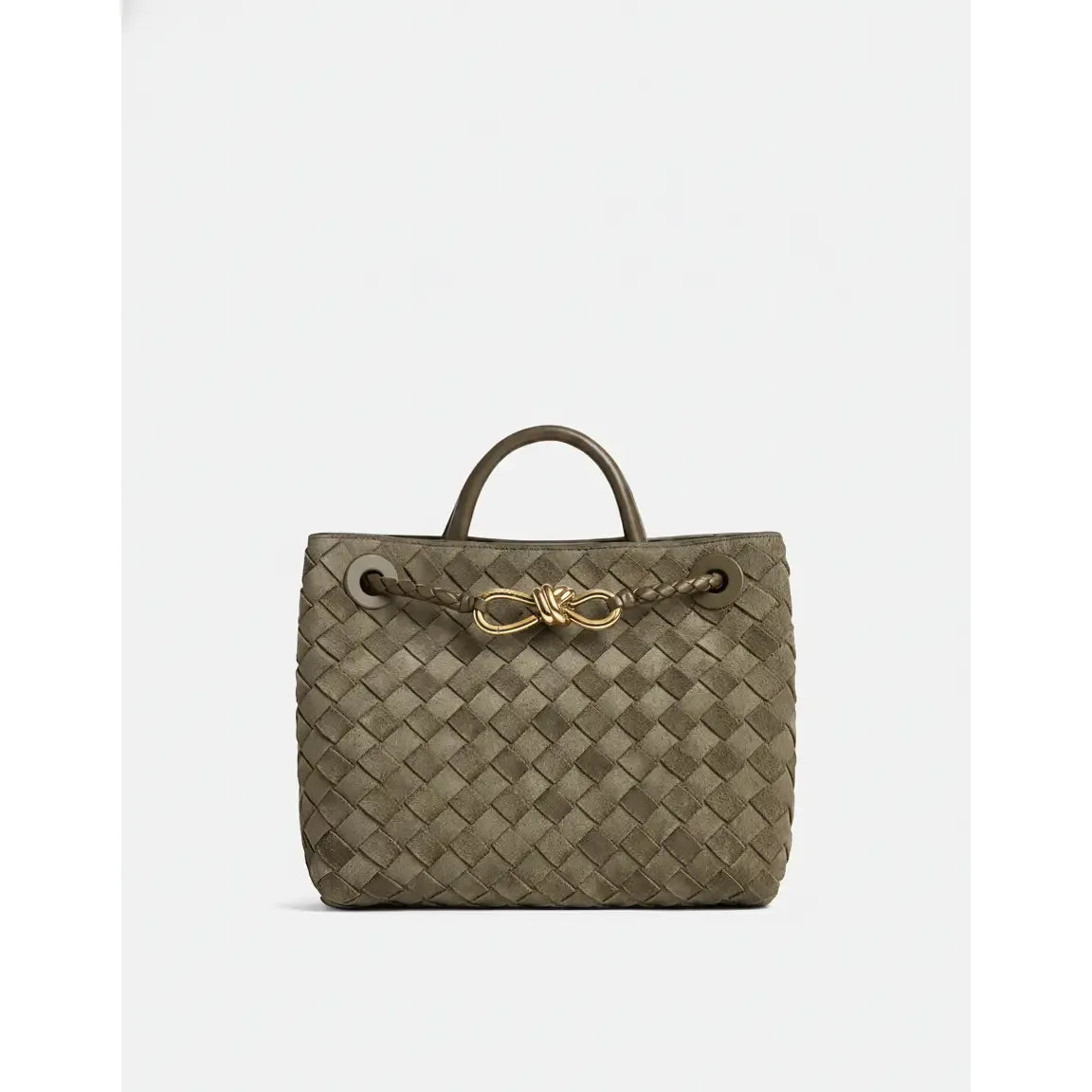 Woven handbag with a gold clasp on a white background