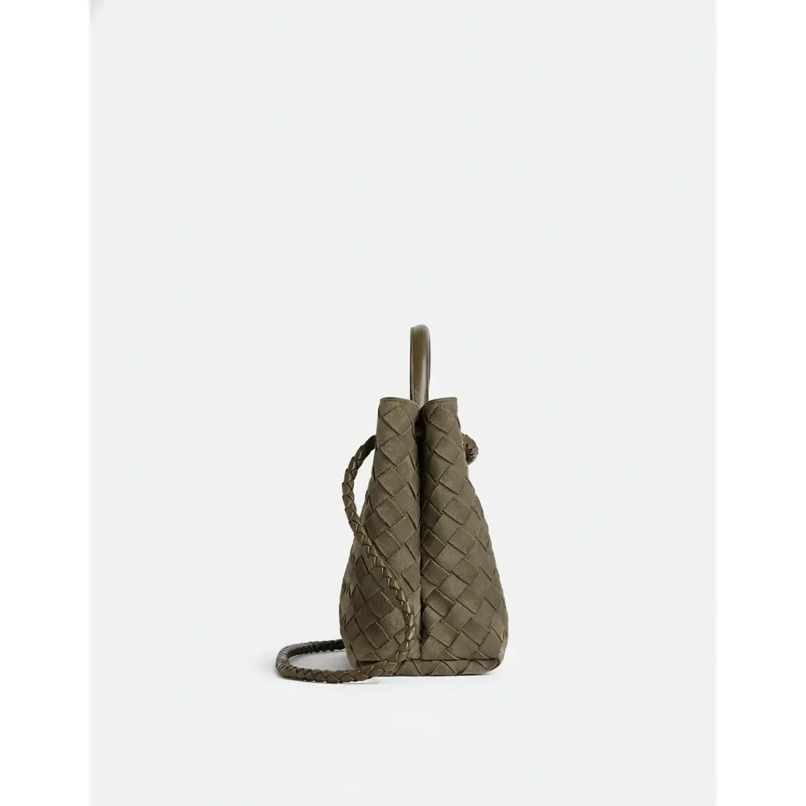 Woven green handbag on a white background
