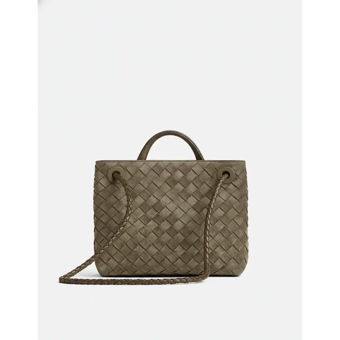 Woven handbag with a shoulder strap on a white background