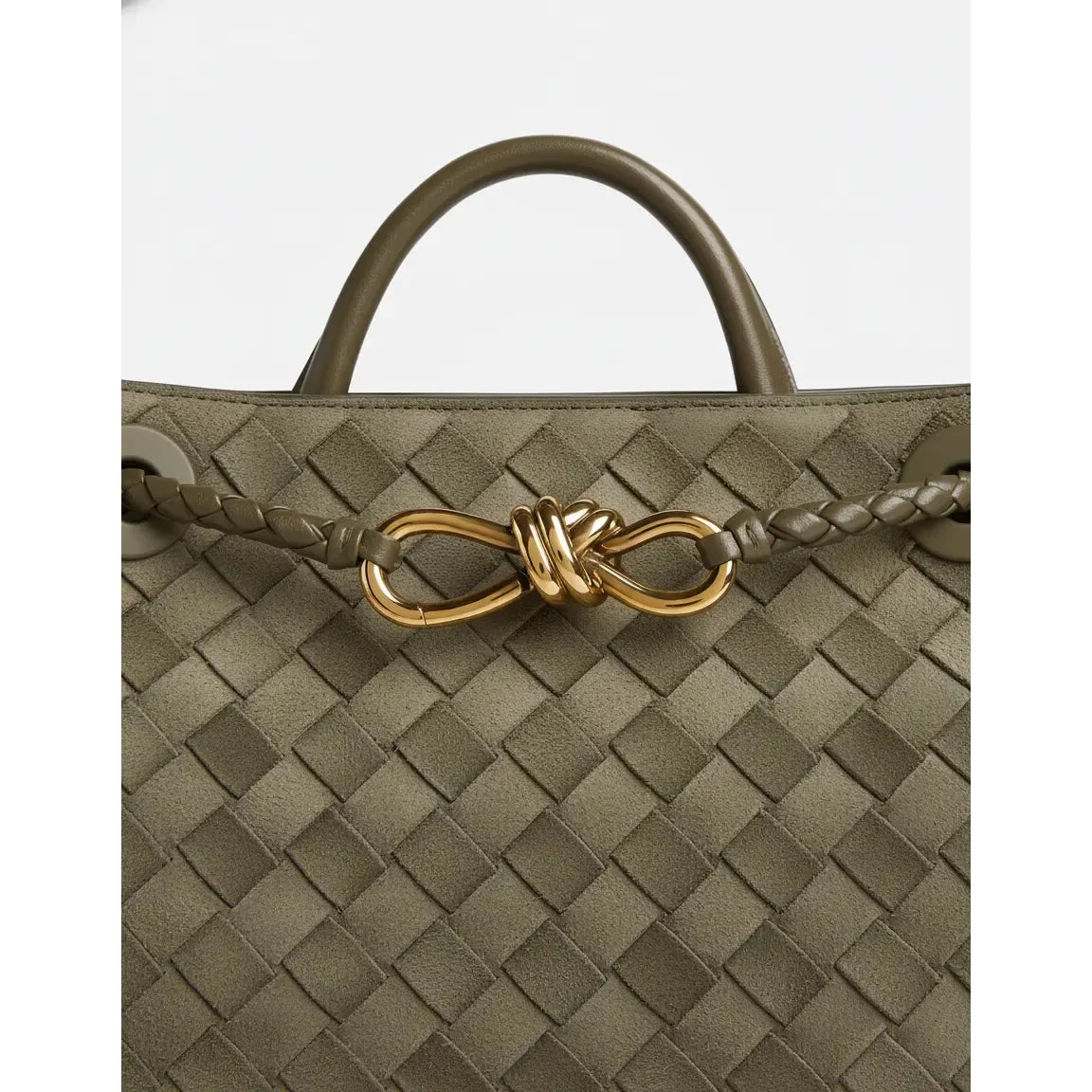 Green woven handbag with a gold clasp on a white background