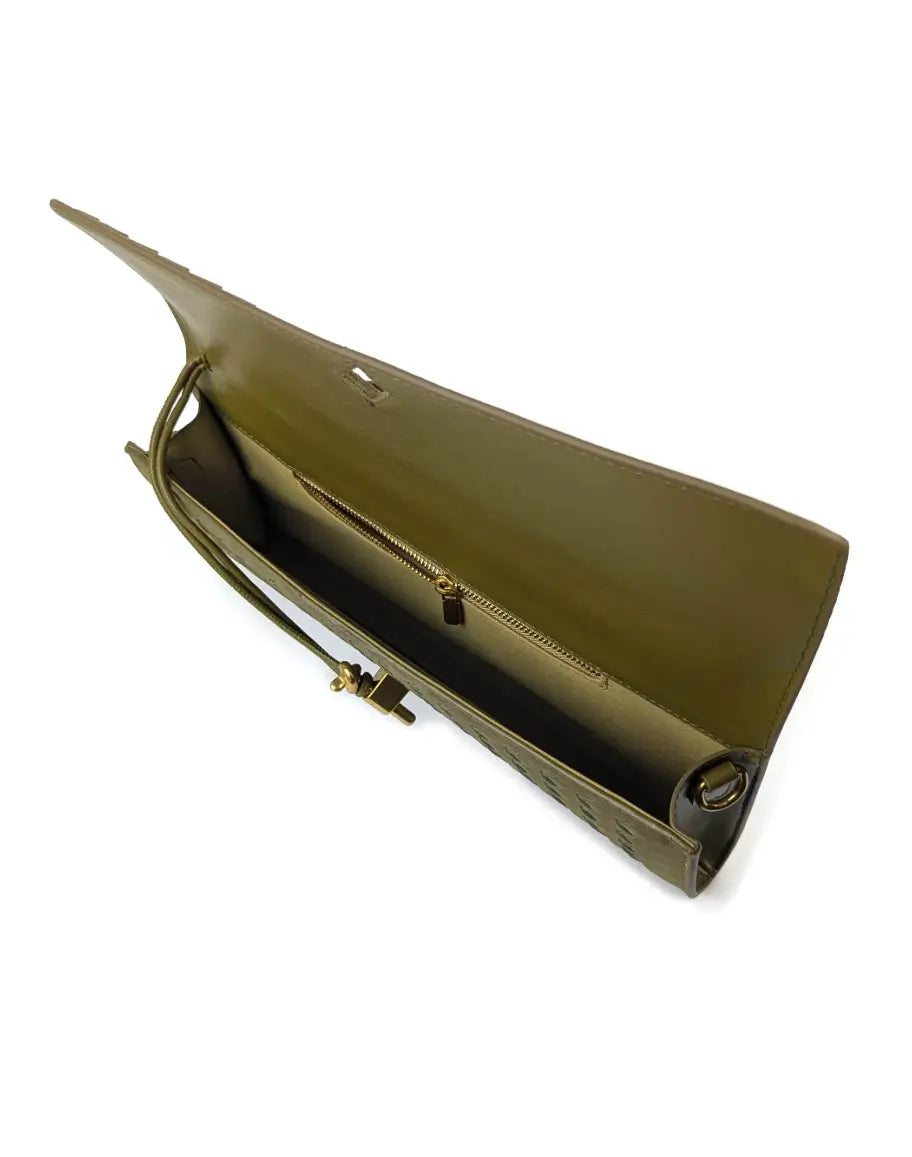 Green clutch bag with a strap on a white background